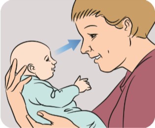 Mother making eye contact with her baby.